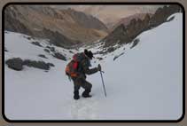 Trekking downhill in snow